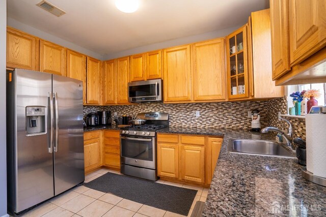 345 Morning Glory Dr, Monroe, NJ 08831 - kitchen with stainless steel appliances, a sink, decorative backsplash, glass insert cabinets, and light tile patterned flooring