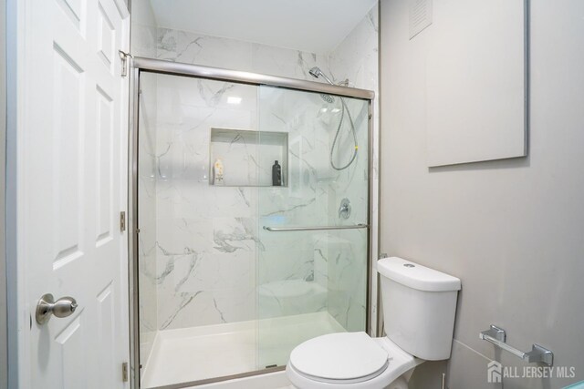 345 Morning Glory Dr, Monroe, NJ 08831 - full bathroom featuring toilet and a marble finish shower