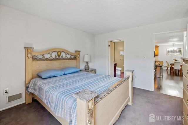 135 Hatfield Ln, East Brunswick, NJ 08816 - bedroom featuring a chandelier, carpet, baseboards, and ensuite bathroom