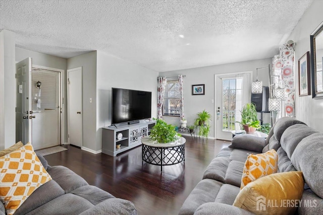 135 Hatfield Ln, East Brunswick, NJ 08816 - living area with baseboards, wood finished floors, and a textured ceiling