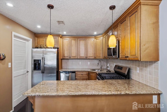135 Hatfield Ln, East Brunswick, NJ 08816 - kitchen featuring tasteful backsplash, brown cabinetry, stainless steel appliances, a sink, and visible vents