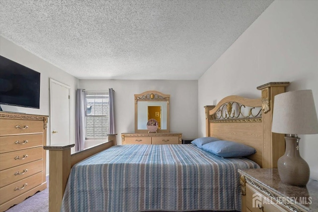 135 Hatfield Ln, East Brunswick, NJ 08816 - bedroom featuring a textured ceiling and carpet flooring