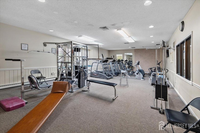 135 Hatfield Ln, East Brunswick, NJ 08816 - exercise room featuring a textured ceiling, a baseboard heating unit, recessed lighting, and carpet
