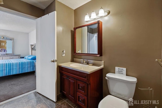 135 Hatfield Ln, East Brunswick, NJ 08816 - ensuite bathroom with a textured ceiling, vanity, toilet, and ensuite bathroom