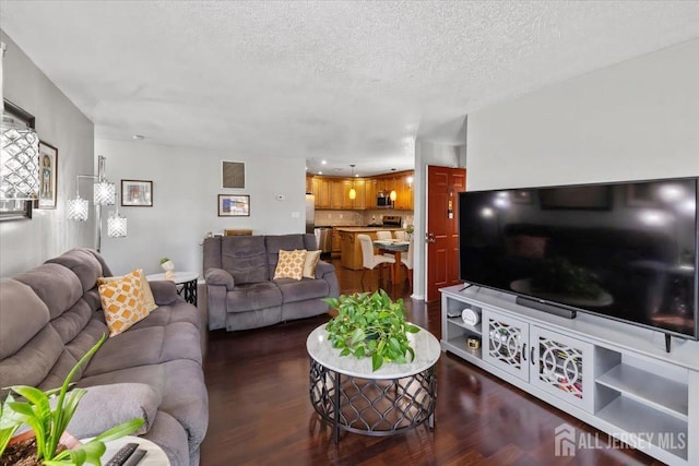 135 Hatfield Ln, East Brunswick, NJ 08816 - living room featuring a textured ceiling, visible vents, and dark wood finished floors