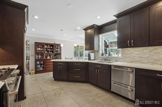4 Franklin Ct, East Brunswick, NJ 08816 - kitchen featuring stainless steel appliances, a peninsula, light countertops, a sink, and dark brown cabinetry