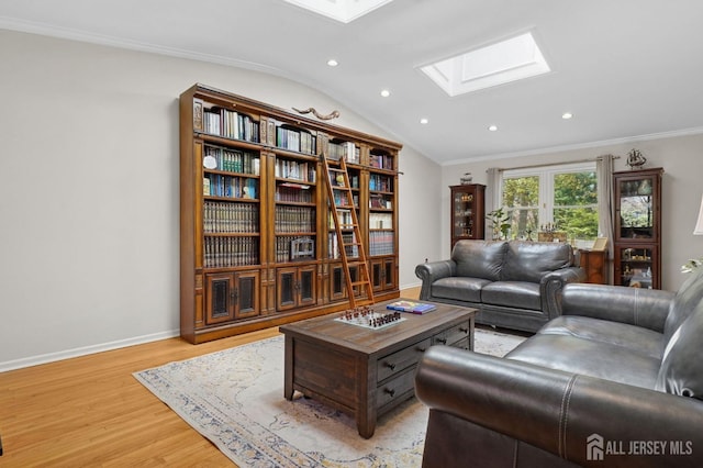 4 Franklin Ct, East Brunswick, NJ 08816 - living area featuring a skylight, vaulted ceiling, light wood-style floors, recessed lighting, and ornamental molding