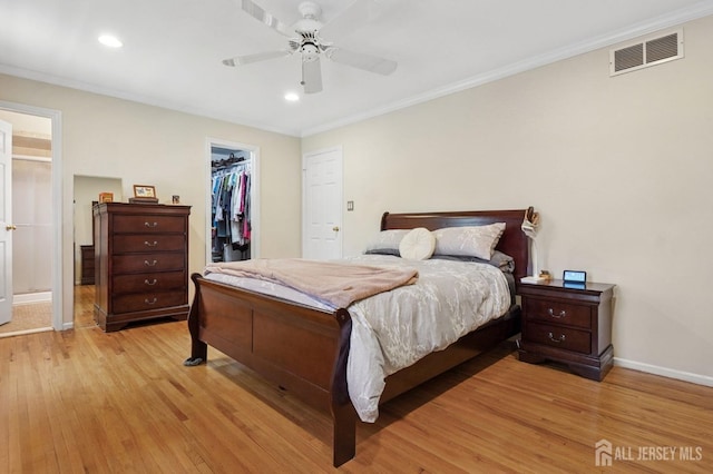 4 Franklin Ct, East Brunswick, NJ 08816 - bedroom featuring light wood-style floors, baseboards, recessed lighting, a spacious closet, and crown molding