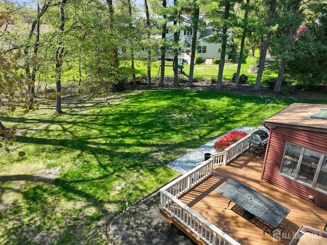 4 Franklin Ct, East Brunswick, NJ 08816 - view of green lawn with a wooden deck
