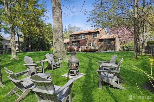 4 Franklin Ct, East Brunswick, NJ 08816 - view of yard featuring an outdoor fire pit and a deck