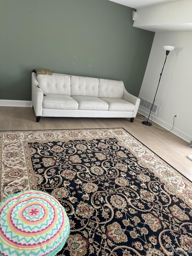 living room with wood-type flooring