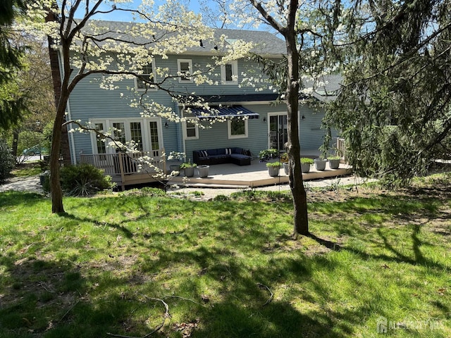 17 SE Candle Ln, East Brunswick, NJ 08816 - back of property featuring an outdoor living space, a lawn, and a wooden deck