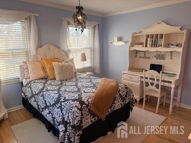 17 SE Candle Ln, East Brunswick, NJ 08816 - bedroom with baseboards, multiple windows, and light wood-type flooring