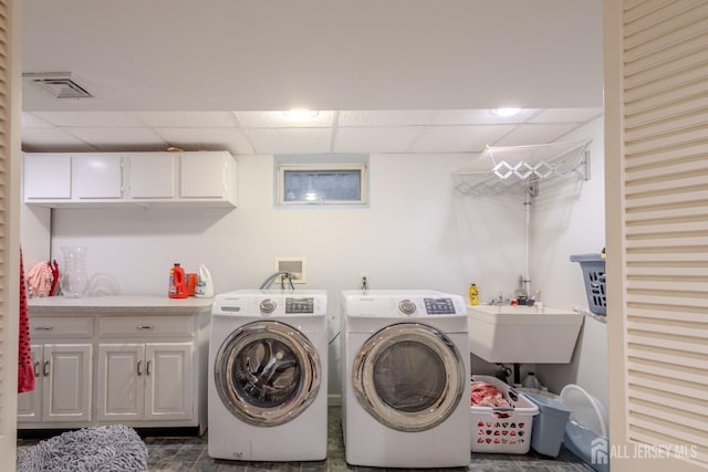 17 SE Candle Ln, East Brunswick, NJ 08816 - laundry room featuring washer and dryer, visible vents, a sink, and cabinet space