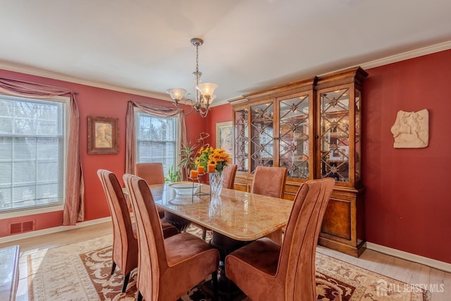 17 SE Candle Ln, East Brunswick, NJ 08816 - dining space featuring baseboards, visible vents, light wood-style flooring, and a chandelier