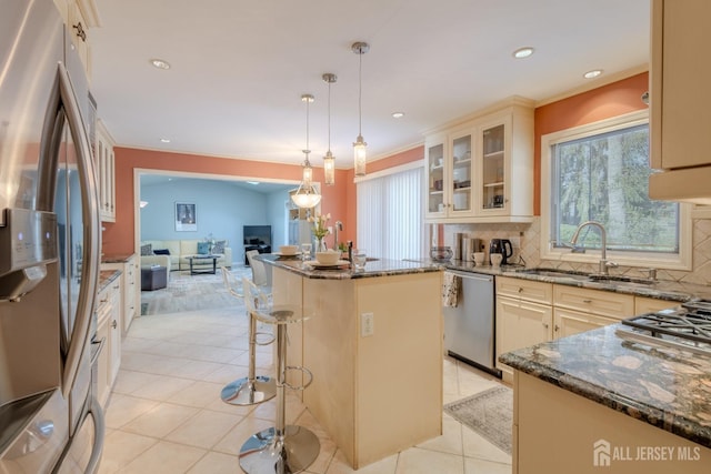 17 SE Candle Ln, East Brunswick, NJ 08816 - kitchen featuring a sink, dark stone countertops, open floor plan, stainless steel appliances, and a wealth of natural light