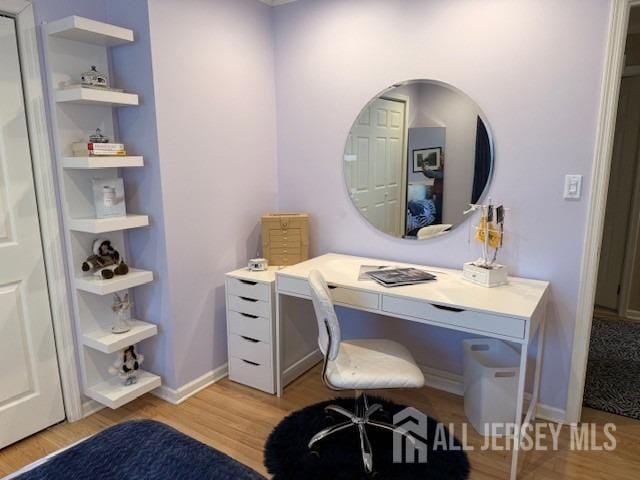 17 SE Candle Ln, East Brunswick, NJ 08816 - office area with baseboards, arched walkways, and light wood finished floors