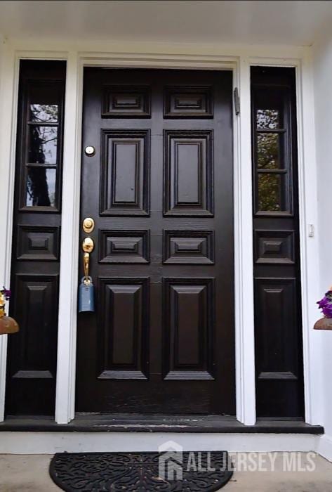 17 SE Candle Ln, East Brunswick, NJ 08816 - doorway to property with a porch