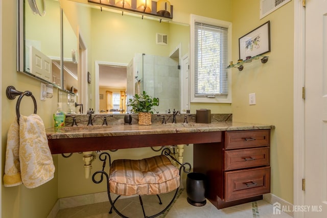 17 SE Candle Ln, East Brunswick, NJ 08816 - full bathroom with visible vents, a tile shower, a sink, and tile patterned flooring