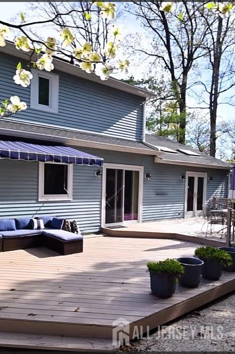 17 SE Candle Ln, East Brunswick, NJ 08816 - rear view of house with an outdoor living space, french doors, and a deck