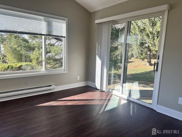 empty room with baseboards, lofted ceiling, and dark wood-style flooring