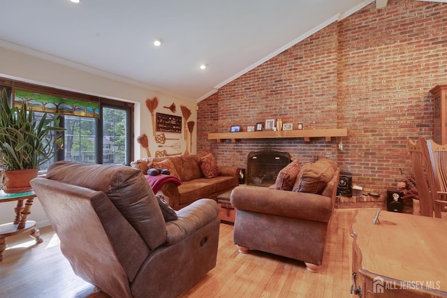 2 Kerry Ct, Old Bridge, NJ 08857 - living room featuring lofted ceiling, light wood-style floors, ornamental molding, brick wall, and a brick fireplace