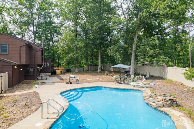 2 Kerry Ct, Old Bridge, NJ 08857 - view of swimming pool with a fenced backyard, a patio, and view of scattered trees
