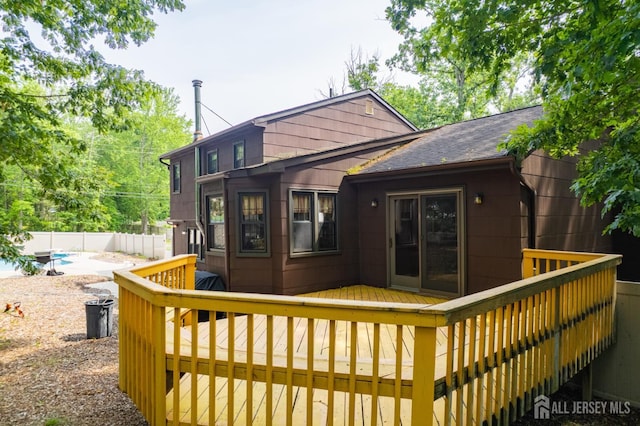 2 Kerry Ct, Old Bridge, NJ 08857 - back of property with a deck and a shingled roof