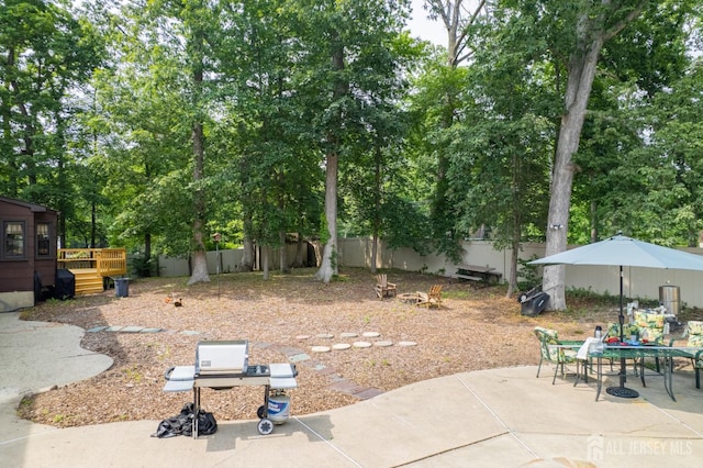 2 Kerry Ct, Old Bridge, NJ 08857 - view of yard featuring a wooden deck, a patio, and outdoor dining space