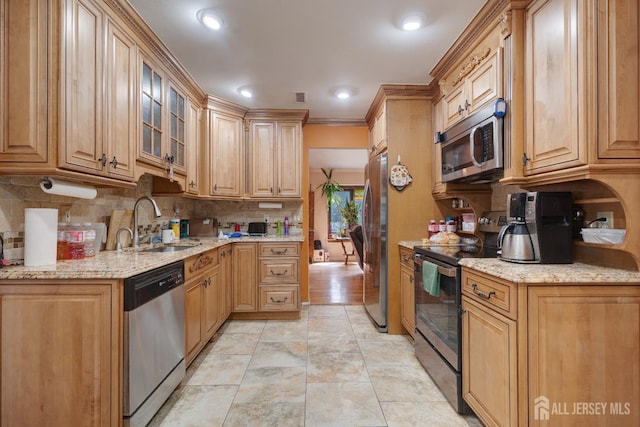 2 Kerry Ct, Old Bridge, NJ 08857 - kitchen with appliances with stainless steel finishes, decorative backsplash, light stone countertops, glass insert cabinets, and crown molding
