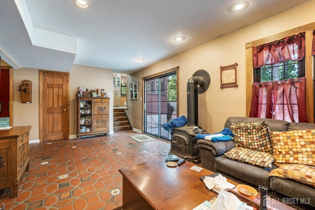 2 Kerry Ct, Old Bridge, NJ 08857 - living area with a wood stove, recessed lighting, stairway, and dark tile patterned floors
