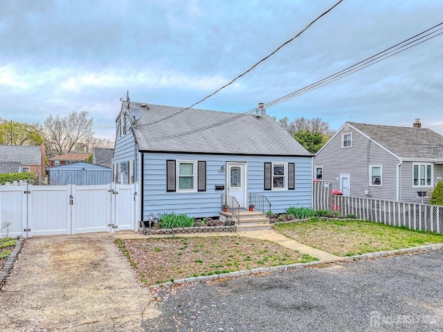 9 Macarthur Ave, Spotswood, NJ 08884 - view of front facade with a gate and roof with shingles