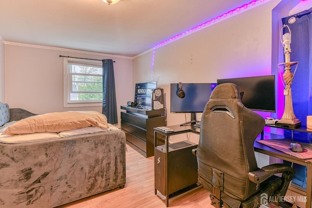 office space with crown molding and wood finished floors