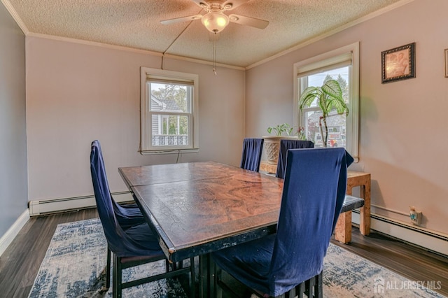 dining area with crown molding, dark wood finished floors, a textured ceiling, ceiling fan, and baseboard heating