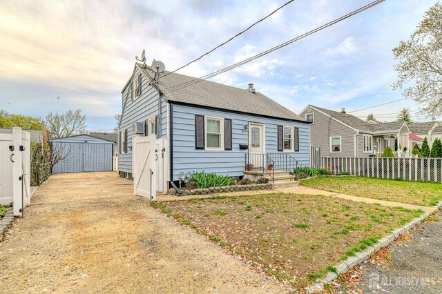 9 Macarthur Ave, Spotswood, NJ 08884 - bungalow-style home with a shingled roof and driveway