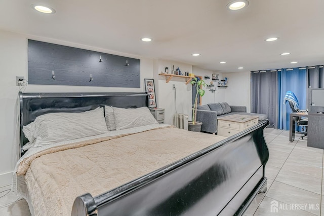 bedroom with recessed lighting, radiator, and light tile patterned floors