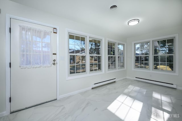 unfurnished sunroom with baseboard heating, a baseboard heating unit, and visible vents