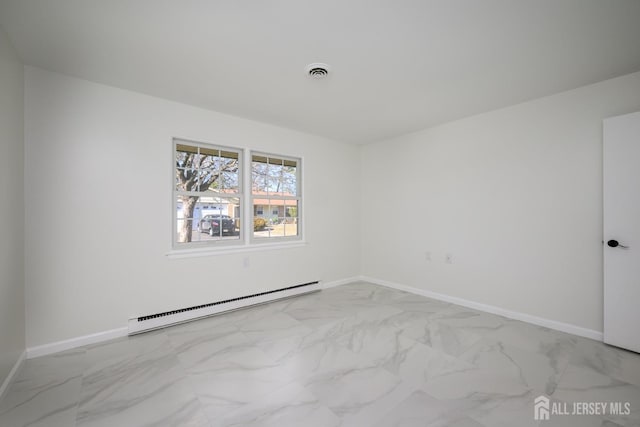 spare room featuring a baseboard heating unit, baseboards, marble finish floor, and visible vents