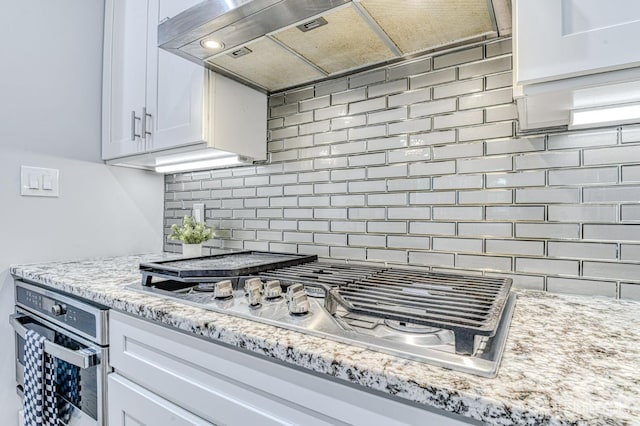 1056 Kearney Dr, North Brunswick, NJ 08902 - kitchen featuring stainless steel appliances, backsplash, white cabinets, and light stone countertops