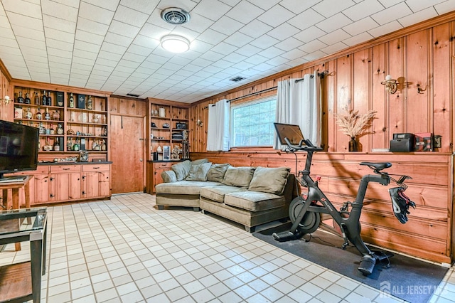 1056 Kearney Dr, North Brunswick, NJ 08902 - living area featuring wooden walls and light tile patterned floors