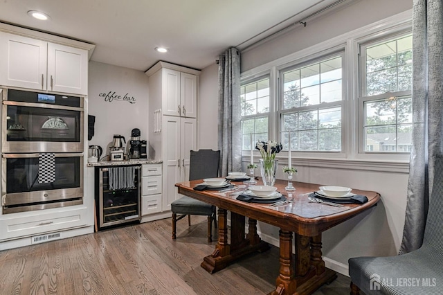 1056 Kearney Dr, North Brunswick, NJ 08902 - dining space featuring beverage cooler, light wood-style flooring, and recessed lighting
