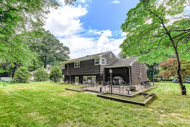 1056 Kearney Dr, North Brunswick, NJ 08902 - back of property with a lawn and a patio area