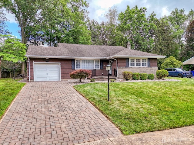 1056 Kearney Dr, North Brunswick, NJ 08902 - ranch-style home with an attached garage, a chimney, a front lawn, decorative driveway, and stone siding
