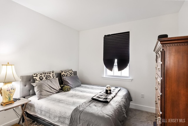 carpeted bedroom featuring baseboards