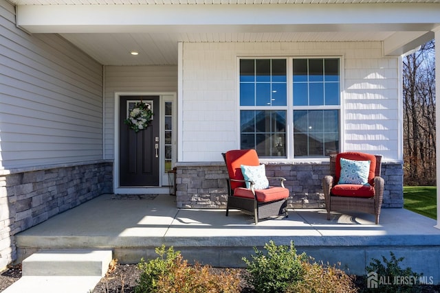 view of exterior entry featuring stone siding