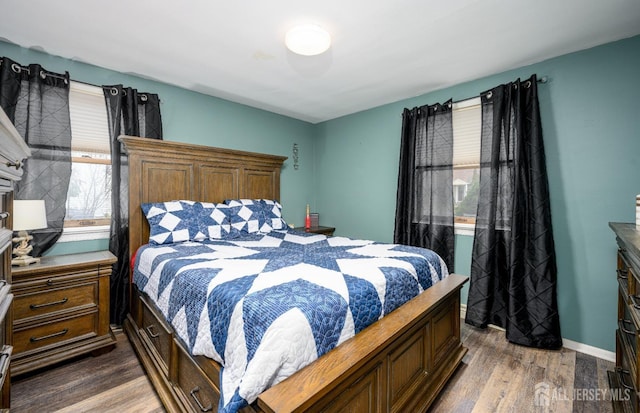 bedroom featuring dark hardwood / wood-style flooring