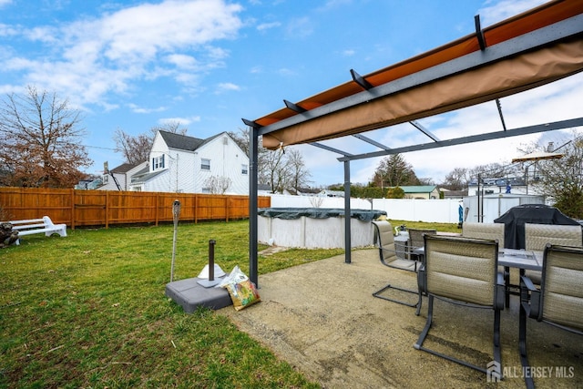 view of yard featuring a fenced in pool, outdoor dining area, a fenced backyard, and a patio