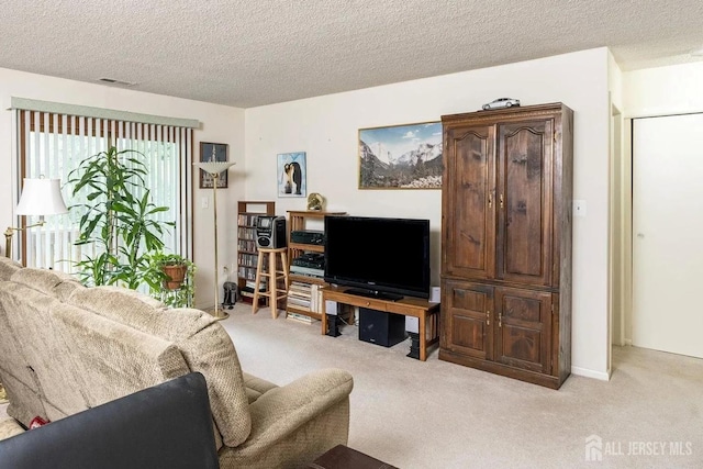 422 Ravens Crest Dr, Plainsboro, NJ 08536 - living area featuring light carpet and a textured ceiling