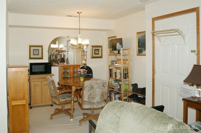 422 Ravens Crest Dr, Plainsboro, NJ 08536 - dining room with a chandelier and light carpet