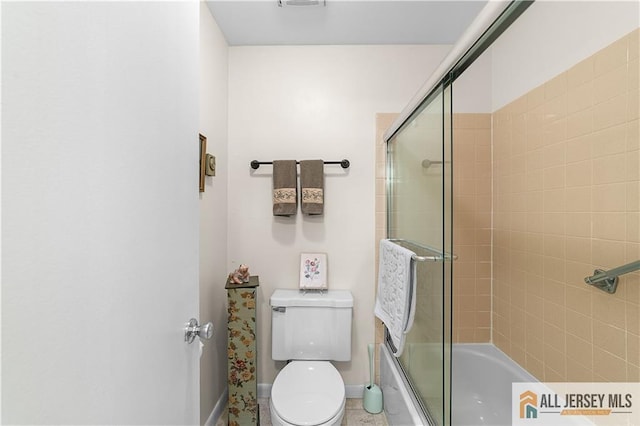 180 Mimosa Plz Unit 180A, Monroe, NJ 08831 - bathroom featuring baseboards, bath / shower combo with glass door, and toilet